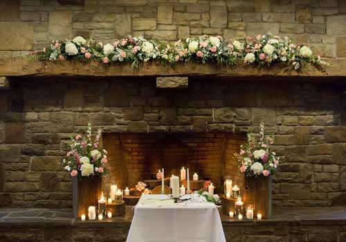 Decorated bridal party table with rustic wedding flowers